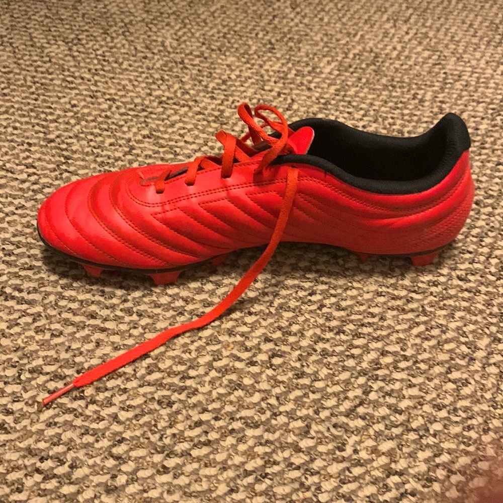 Red and white soccer cleats